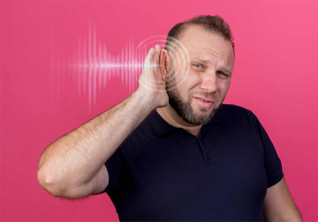 man experiencing hearing issues